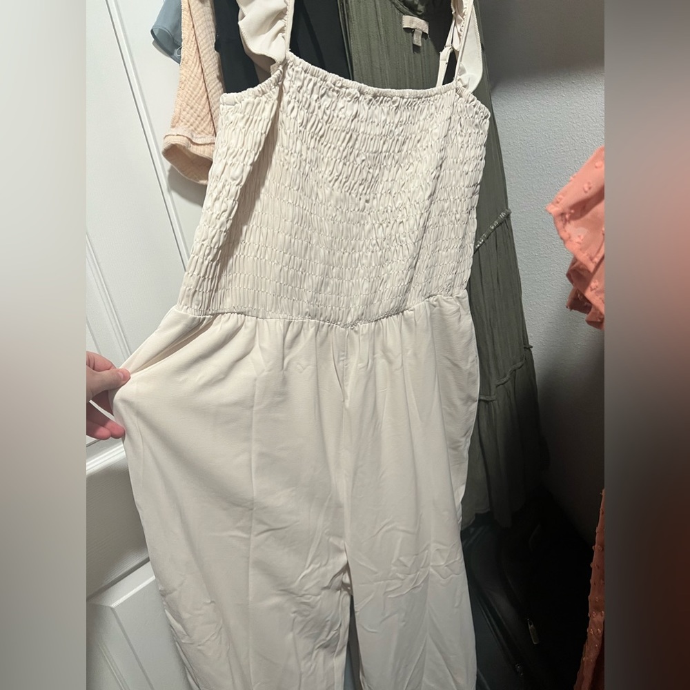 Cream Jumpsuit with ruffled sleeves